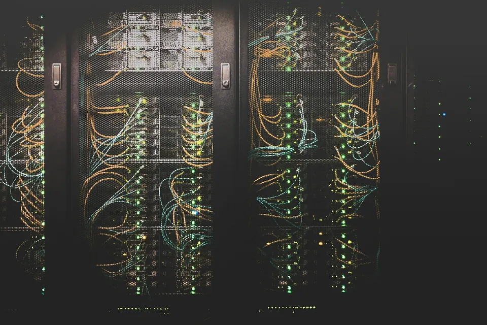 Network cables plugged into a rack of servers
