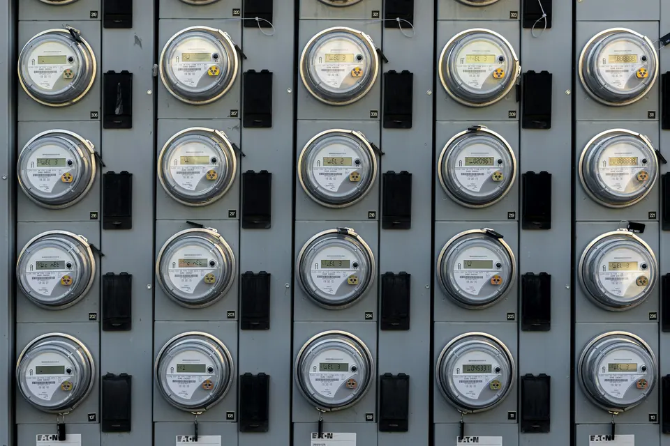 Rows of electricity meters on a wall