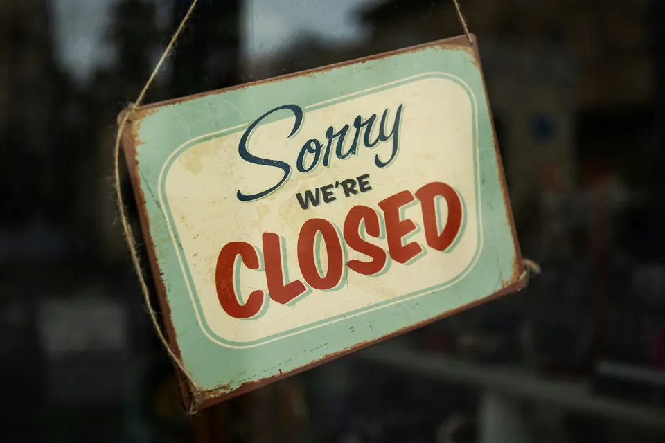 A sign reading sorry we're closed