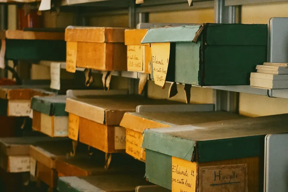 Archive shelves full of labeled boxes