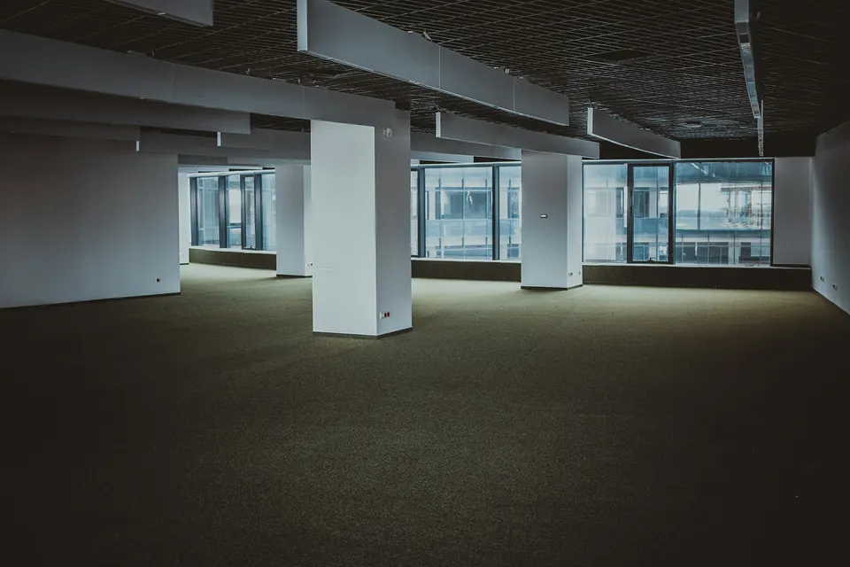 An empty office floor with bare columns