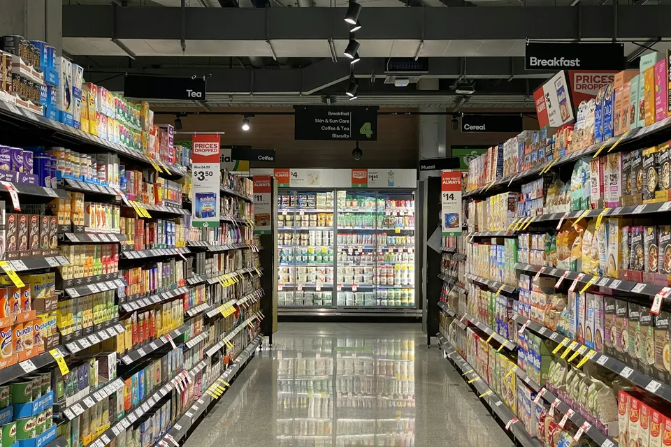 Supermarket aisle with packaged food on both sides