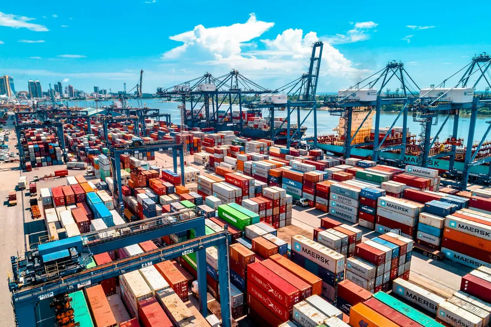 A container port with stacked containers and cranes